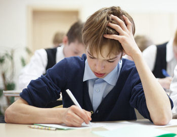 school child in exam helped by hypnotherapy